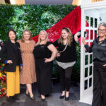 group shot of 5 women at the photo booth wall at the Halifax Wonder Women Conference