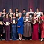 event photo of award recipients at formal ceremony