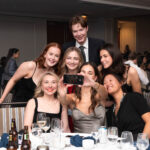 group of CAPSI students at formal banquet taking selfie