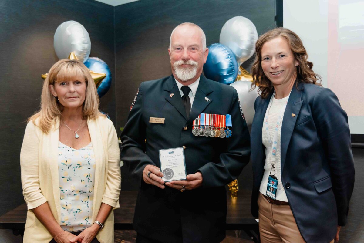 male paramedic receiving years of service award