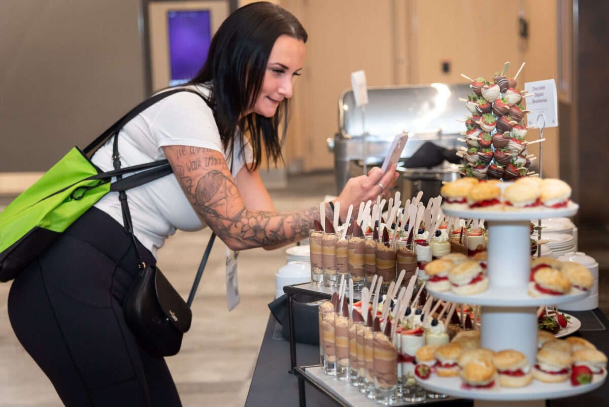 women taking a iPhone photo of the dessert display at Halifax Convention Centre