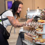 women taking a iPhone photo of the dessert display at Halifax Convention Centre