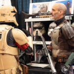 a storm trooper shopping a vendor booth at Hal-Con