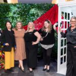 group shot of 5 women at the photo booth wall at the Halifax Wonder Women Conference
