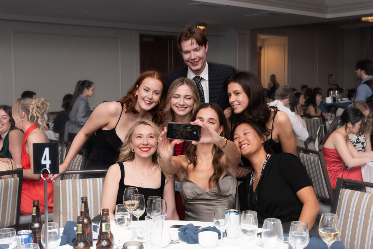 group of CAPSI students at formal banquet taking selfie