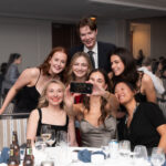 group of CAPSI students at formal banquet taking selfie